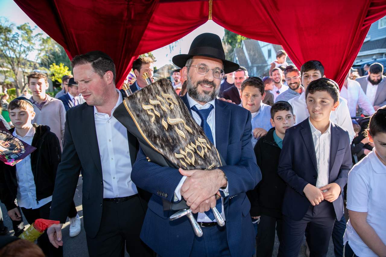 Dancing with the Sefer Torah beneath the chuppah