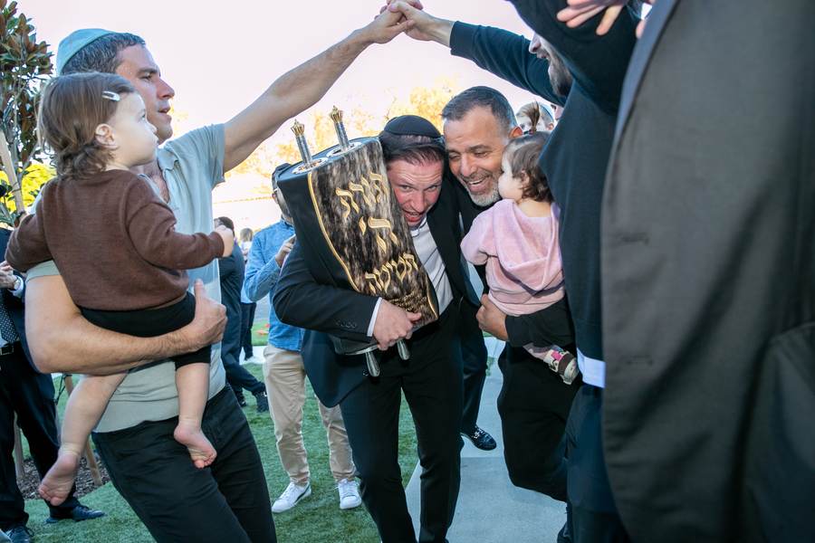 Carrying the Torah, with little ones on their fathers’ shoulders