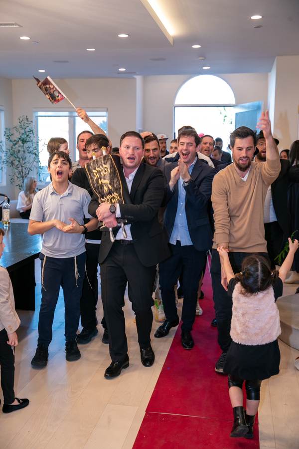 Dancing with the Torah through the house
