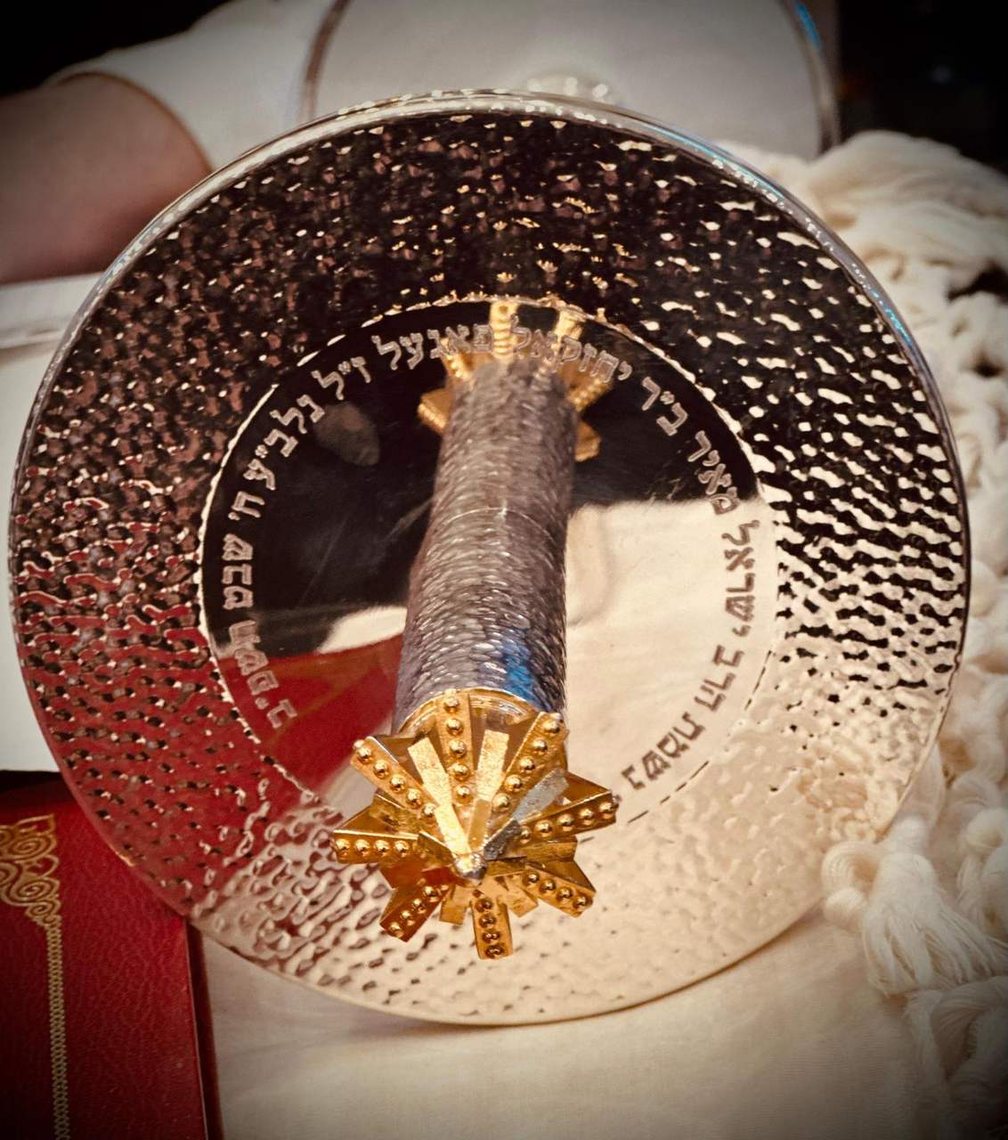 The new Sefer Torah with its silver yad and crown